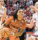  ?? DARRON CUMMINGS/AP ?? Miami’s Destiny Harden puts up a shot against Indiana’s Grace Berger during a second-round NCAA Tournament game Monday night.