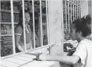  ?? NICK PERRY/ THE ASSOCIATED PRESS ?? A roadside store near Nuku’alofa, Tonga. Many Tongans have mixed feelings about China’s impact on their country.