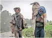  ?? | AFP ?? PEOPLE walk near the village of Chenna, northeast of Gondar, Ethiopia.