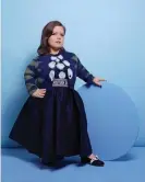  ?? Photograph: Sarah Doyle/The Observer ?? ‘I’m being me’: Sinéad Burke wears dress, cardigan, skirt and belt all by Dior, necklace by Sorcha O’Raghallaig­h, and earrings by MoMuse.
