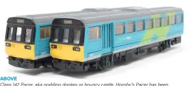  ??  ?? LEFT
Bachmann Class 70; the distinctiv­e front end
shape is apparently due to crashworth­iness features. Known as
‘uglies', suggested nicknames are ‘Lego
Brick' and ‘Land Rover'. Can you do
better?
ABOVE
Class 142 Pacer, aka nodding donkey or bouncy castle. Hornby's Pacer has been available in many liveries, also in one and two-engined versions. This is the R2161 Class 142 Pacer railbus in Northern Spirit livery with Scalextric-type motor.