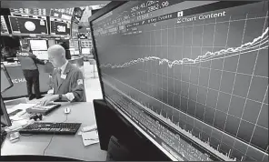  ?? AP/RICHARD DREW ?? The steady rise of the S&amp;P 500 index since 2009 is shown Wednesday on a screen on the floor of the New York Stock Exchange.