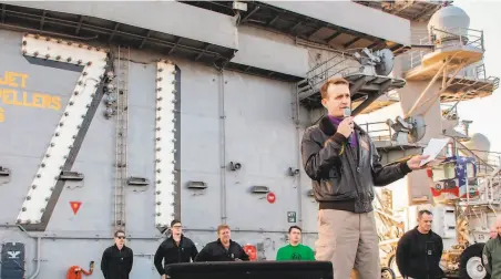  ?? Seamen Alexander Williams / U.S. Navy 2019 ?? Navy Capt. Brett Crozier addresses his crew aboard the nuclear aircraft carrier Theodore Roosevelt in December.