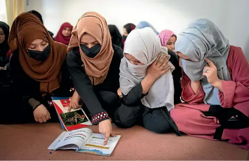  ?? WASHINGTON POST. ?? Some of the clandestin­e students. All are poor, and most cannot pay any fees or buy textbooks.