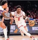  ?? SPORTS ROBERT DEUTSCH/USA TODAY ?? Wisconsin guard AJ Storr dribbles the ball against James Madison guard Terrence Edwards Jr. during a March 22 game.