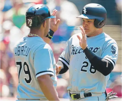  ?? | JASON MILLER/ GETTY IMAGES ?? Avisail Garcia ( with teammate Jose Abreu) is fifth among American League outfielder­s in All- Star balloting.
