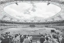  ?? JUSTIN SETTERFIEL­D GETTY IMAGES ?? The national anthem is played at London Stadium prior to the game between the New York Yankees and the Boston Red Sox on Sunday.