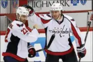  ?? GENE J. PUSKAR – THE ASSOCIATED PRESS ?? FILE - In this Monday, May 1, 2017, file photo, Washington Capitals’ Kevin Shattenkir­k (22) celebrates with T.J. Oshie (77) after scoring the game-winning goal in overtime of Game 3in an NHL Stanley Cup Eastern Conference semifinal hockey game against...