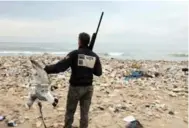  ?? AFP/GETTY IMAGES ?? Hunters shoot down seagulls at the Costa Brava dump, near Beirut’s Internatio­nal Airport.