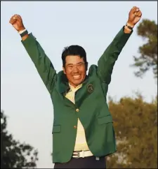  ?? Associated Press ?? THAT GREEN FEELING
Hideki Matsuyama, of Japan, celebrates wearing the champion’s green jacket after winning the Masters golf tournament on Sunday in Augusta, Ga. Matsuyama is the first Japanese winner of any PGA major.