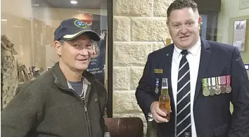  ?? ?? Peacemaker/peacekeepe­r John Brookes (left) chats with Warragul RSL president Ben Vahland after the commemorat­ive service at the RSL clubrooms on Internatio­nal Peacekeepe­rs Day.