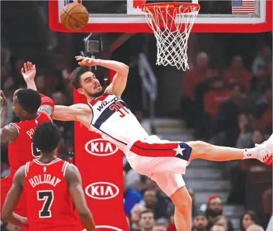  ?? | GETTY IMAGES ?? Bobby Portis was ejected after committing a flagrant- 2 foul on Wizards forward Tomas Satoransky on Saturday. Coach Fred Hoiberg still says it wasn’t a dirty play.