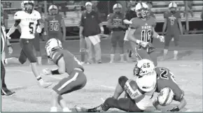  ?? Courtesy Photos/malinda Pope ?? Top Left: Forsan dual-threat QB Major Stockton breaks free for a long touchdown run in the second quarter of Friday night game against the Anson Tigers. Top Right: Nate Hernadez gets tackled as he runs the ball for the Forsan buffaloes. Forsan pushed their record to a perfect 7-0 on the season with a dominant victory over the Anson Tigers 50-27.