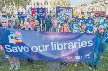  ??  ?? Protesters, left, in London opposing library closures highlighte­d by the Daily Express