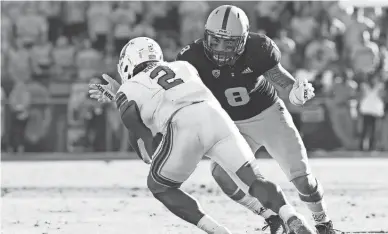  ??  ?? Arizona State linebacker Merlin Robertson (8) tackles Utah’s Zack Moss on Nov. 3 at Sun Devil Stadium. Robertson will have to sit out the first half of Saturday’s game after being ejected for targeting vs. UCLA last Saturday.