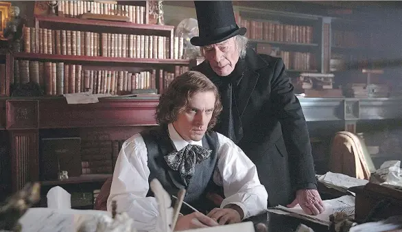  ?? ELEVATION PICTURES ?? Charles Dickens, left, portrayed by Dan Stevens, is inspired by the grouchy Ebenezer, played by Christophe­r Plummer, in The Man Who Invented Christmas.