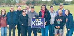  ?? ?? Tom Keen, center left, canvassed neighborho­ods and knocked on numerous doors with the help of volunteers in his quest to win a House District 35 special election. Rep. Fentrice Driskell, center right, the Democratic minority leader, provided help, counsel and funding along the way.