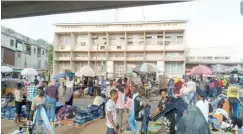  ?? PHOTO: ?? NIPOST office in Kwara State continues to compete for space with other traders Mumini Abdulkaree­m