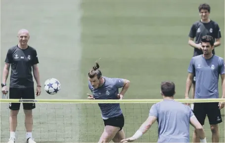  ?? ?? Wales star Gareth Bale gets in a header as Real Madrid prepare to meet Juventus in tomorrow night’s UEFA Champions League final in Cardiff.