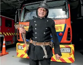  ?? PHOTO: SCOTT HAMMOND/STUFF ?? Raynor Henson in his original woollen firefighti­ng uniform.