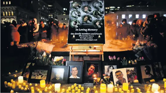  ?? DAVE CHAN ?? People gather for a vigil for victims of the plane crash in Iran held in Ottawa, Canada