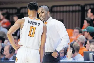  ?? Oklahoma State coach Mike Boynton talks with freshman point guard Avery Anderson III earlier this season. ?? [BRYAN TERRY/ THE OKLAHOMAN]