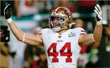  ?? AP PHOTO BY DAVID J. PHILLIP ?? In this Feb. 2, 2020 file photo San Francisco 49ers’ Kyle Juszczyk celebrates his touchdown against the Kansas City Chiefs during the first half of the NFL Super Bowl 54 football game in Miami Gardens, Fla. The 49ers are encouraged about how productive their virtual offseason has gone in response to the COVID-19 pandemic. Juszczyk believes players are able to get even more time learning intricacie­s of the offense without the pressure of going out on the field to practice each day and has enjoyed the banter and bonding across the video screens.