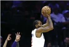  ?? TIM NWACHUKWU — GETTY IMAGES ?? Kawhi Leonard of the Clippers, taking a shot in the third quarter, had 17 points and 10 rebounds in a 108-107 win over the Philadelph­ia 76ers.
BSSC