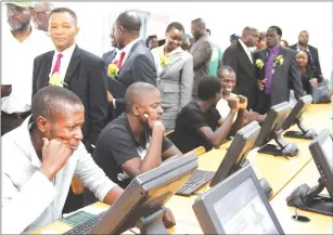  ?? — (Picture by Innocent Makawa) ?? Transport and Infrastruc­tural Developmen­t Minister Joel Biggie Matiza (standing, left) launches the electronic learner’s licence test system in Harare yesterday as part of measures to end corruption in the issuance of driver’s licences.