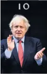  ??  ?? British Prime Minister Boris Johnson clapping for our carers outside 10 Downing Street in May