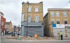  ??  ?? Surfers braved rough seas and high winds at Hastings in East Sussex, above; a tree fell on an empty car in Richmond, west London, far left; and a roof collapsed in Stoke Newington, in the East End, left