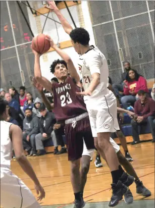  ?? Photos by Ernest A. Brown ?? Dwayne Robinson-O’Hagan (5, left), Jossue Hernandez (23, above) and the Woonsocket boys basketball team picked up an important road victory over Mt. Pleasant Thursday night.