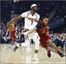  ?? RON SCHWANE — THE ASSOCIATED PRESS ?? Nuggets guard Reggie Jackson plays against Cavaliers guard Darius Garland during the first half on Thursday in Cleveland.