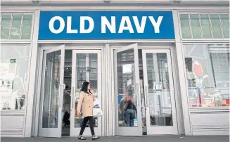  ?? AFP ?? A woman carries her shopping bag as she exits an Old Navy store in New York City in this photo taken on May 12, 2017.