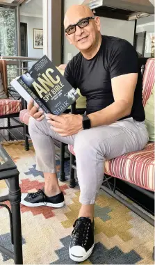  ?? KEVIN RITCHIE ?? MOE Shaik, in his Pretoria home, holds a copy of his memoirs which took him four years to write. |