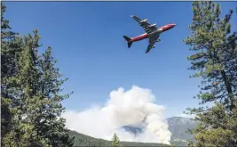  ?? NOAH BERGER — THE ASSOCIATED PRESS FILE ?? An air tanker prepares to drop retardant while battling the August Complex Fire in the Mendocino National Forest on Sept. 17.