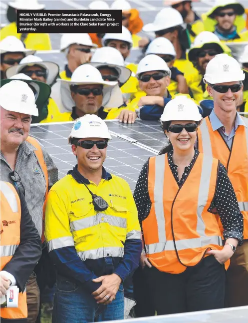  ?? HIGHLY VISIBLE: Premier Annastacia Palaszczuk, Energy Minister Mark Bailey ( and Burdekin candidate Mike Brunker ( with workers at the Clare Solar Farm project yesterday. ?? far left) centre)