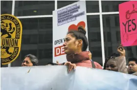  ??  ?? Daniela Cardona of Richmond joins people outside a federal court hearing about protection for people from Haiti, El Salvador, Sudan and Nicaragua.