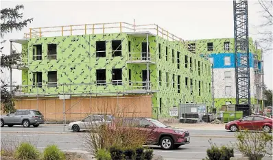  ?? DAVID BEBEE WATERLOO REGION RECORD ?? Constructi­on is underway at 195 Hespeler Rd. in Cambridge where two apartment buildings, one with 55 affordable units, are being built on the site of the former Satellite Motel. Some residents in the building will pay just below average market rates.