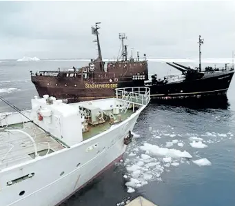  ?? SEA SHEPHERD CONSERVATI­ON SOCIETY HANDOUT/GETTY IMAGES ?? Japanese whaling ship Kaiko Maru, left, and the Farley Mowat protest boat are seen in this file photo.