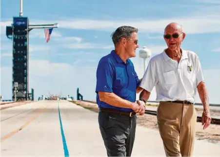  ?? Frank Michaux / Associated Press ?? Apollo 11 astronaut Michael Collins, right, chats with Kennedy Space Center Director Bob Cabana on Tuesday in Florida.