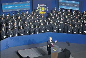  ?? [TOM BRENNER/THE NEW YORK TIMES] ?? President Donald Trump addresses law enforcemen­t officers in Suffolk County, New York, on Friday, telling them not to be “too nice” when handling prisoners.