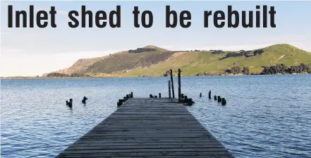  ?? PHOTO: STEPHEN JAQUIERY ?? Replacemen­t coming . . . The photogenic Hoopers Inlet boat shed destroyed by wild weather is to be rebuilt, its owners say.