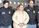  ?? AP FILES ?? Authoritie­s escort Joaquin “El Chapo” Guzman from a plane to a waiting caravan of SUVs in 2017 in Ronkonkoma, N.Y.