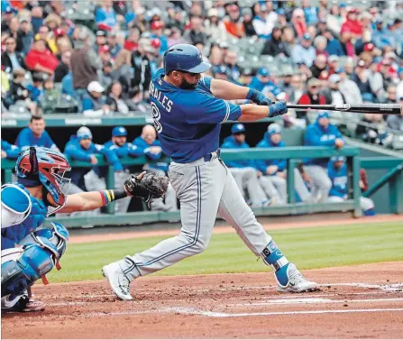  ?? JIM COWSERT THE ASSOCIATED PRESS ?? Blue Jays' Kendrys Morales follows through on his three-run home run in front of Texas Rangers catcher Robinson Chirinos. in the first inning.