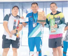  ?? DCM PHOTOS ?? DCM KING AND QUEEN. Davao City’s Elmer Bartolo and Siargao’s Madelyn Carter race to secure the men’s and women’s 42-kilometer title of the recently concluded Davao City Marathon held in an out-and-back course from NCCC Mall Victoria Plaza, J.P. Laurel Avenue, Davao City.