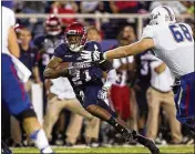  ?? BILL INGRAM / THE PALM BEACH POST ?? D’Joun Smith returns an intercepti­on against Tulsa in 2014. Smith is the highest-drafted Owl ever, going No. 65 to the Colts in 2015.