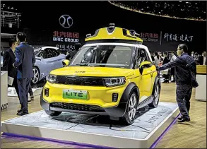  ?? Bloomberg News/QILAI SHEN ?? A BAIC Motor Corp. electric vehicle is displayed in April during the Beijing Internatio­nal Automotive Exhibition.