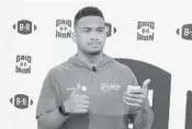  ?? SAFID DEEN/SUN SENTINEL ?? Tua Tagovailoa, the injured Alabama quarterbac­k linked to the Dolphins in the draft, poses in a video shoot last week.