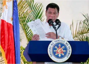  ?? AFP ?? Philippine President Rodrigo Duterte delivering a speech prior to his departure for the APEC summit in Peru, at Davao airport in the southern island of Mindanao on Thursday. —